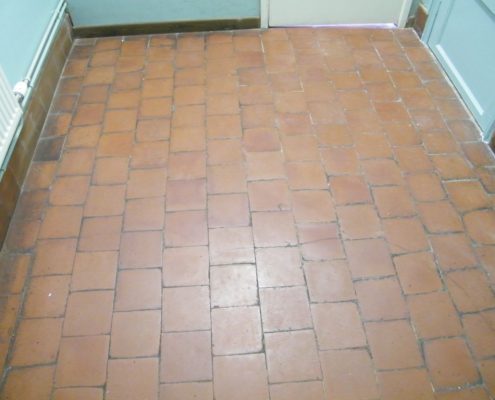 Cloakroom quarry tile before cleaning