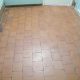 Cloakroom quarry tile before cleaning