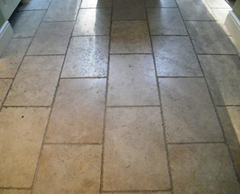 Travertine kitchen floor before cleaning