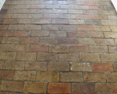 Suffolk brick kitchen floor before cleaning