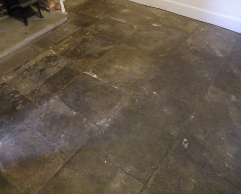Flagstone floor before cleaning