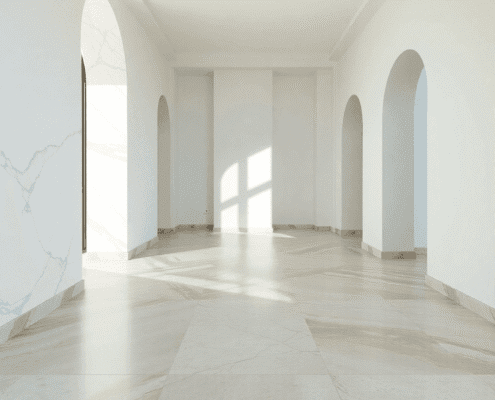 Bright interior with polished marble, granite, limestone, slate, and travertine floors showcasing varied textures and colors in soft natural light.