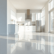 Bright modern kitchen with shiny vinyl floor reflecting natural light, featuring smooth seamless surfaces and a clean, durable design.