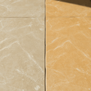 Close-up of a natural stone floor showing a smooth transition from dull, worn texture to polished, shiny surface under soft natural light.