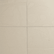 Close-up of elegant travertine floor tiles with natural earth tones, unique patterns, and varied polished and honed textures under soft lighting.