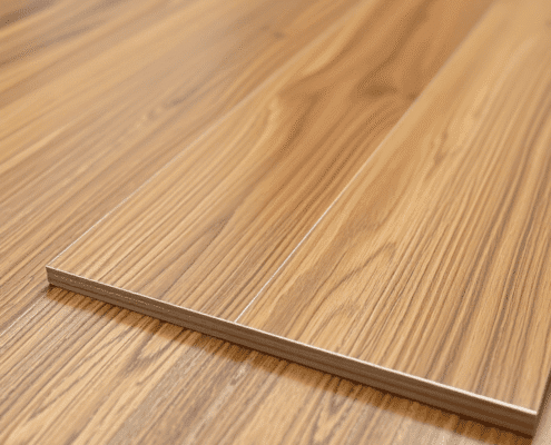 Close-up of glossy luxury vinyl flooring with realistic wood grain texture and subtle reflections, highlighting durability and premium quality.