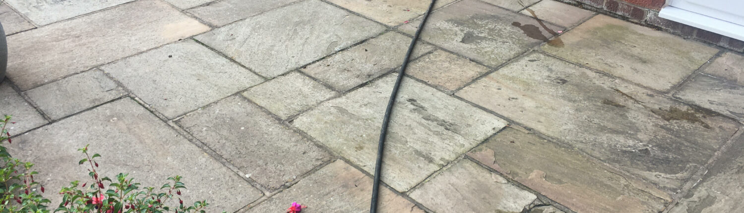 Indian stone patio in Holmes Chapel, Cheshire before cleaning