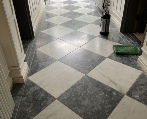 Marble hallway floor before cleaning and polishing in Bowden, Altrincham, Cheshire