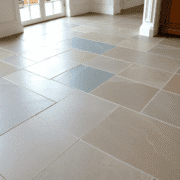 Slate floor with natural color variations and subtle sheen, highlighting textured layered mineral patterns in a bright, inviting interior.