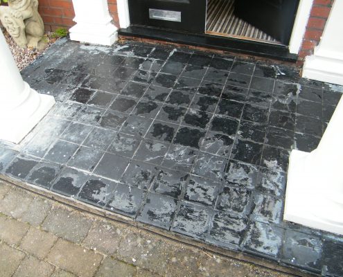 Tiled porch restoration before