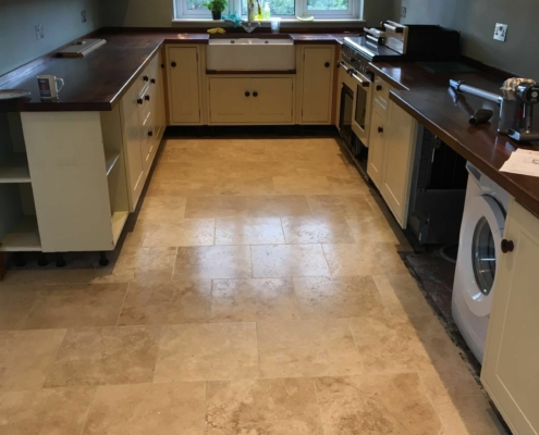 Travertine floor in Alderley Edge, Cheshire after cleaning, filling sealing and polishing