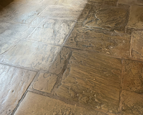 Yorkstone Bar floor before cleaning and sealing in The Swan Hotel, Tarporley, Cheshire