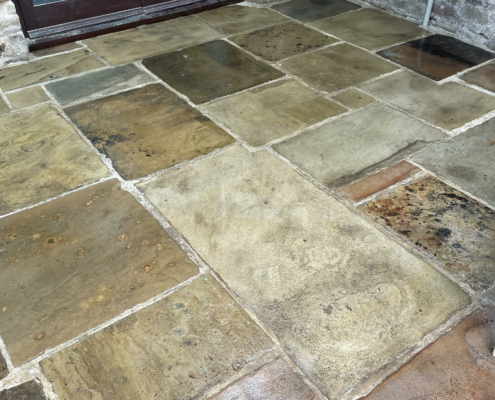Yorkstone floor after cleaning and sealing using colour enhancer in Thornhill, Hope Valley, Derbyshire