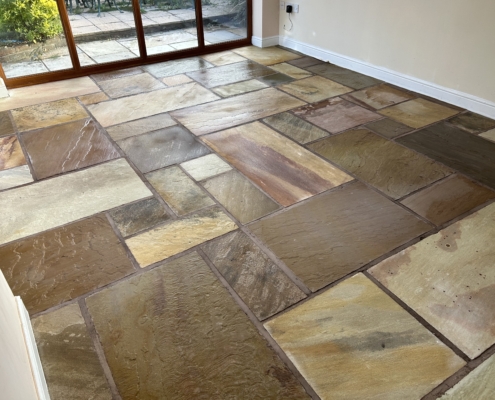 Indian stone conservatory floor, deep cleaned and colour enhanced in Hope Valley, Derbyshire, after